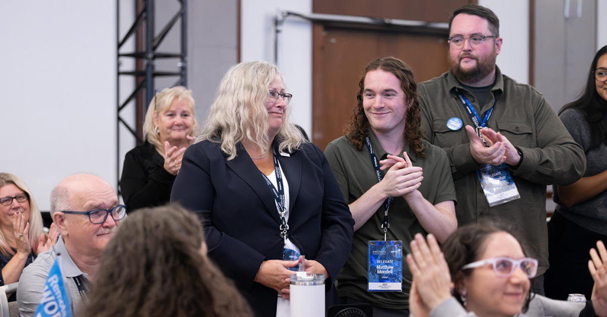 Image of Delegates congratulating Cynthia Watt on being re-elected as VP to AMAPCEO's Executive Committee