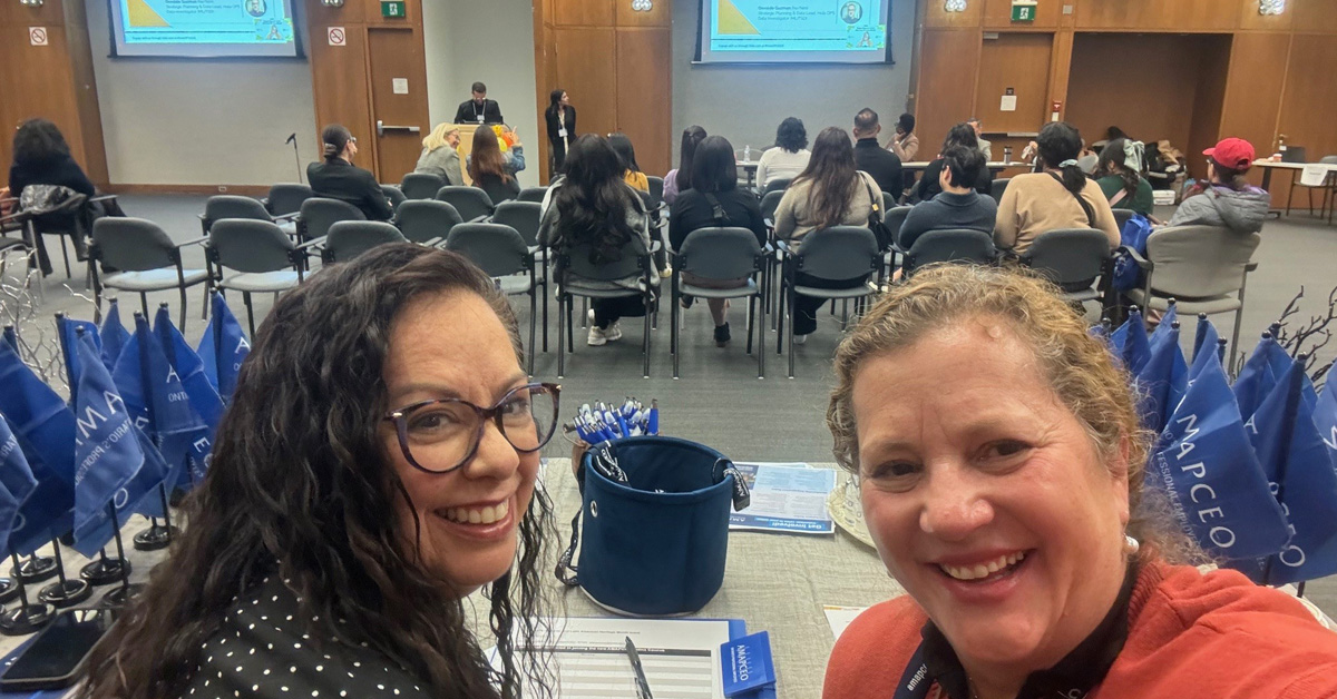 Latinx Caucus Chair Maria Lopez-Pevide and Vice-Chair Valeria Netto at AMAPCEO booth in HolaOPS event