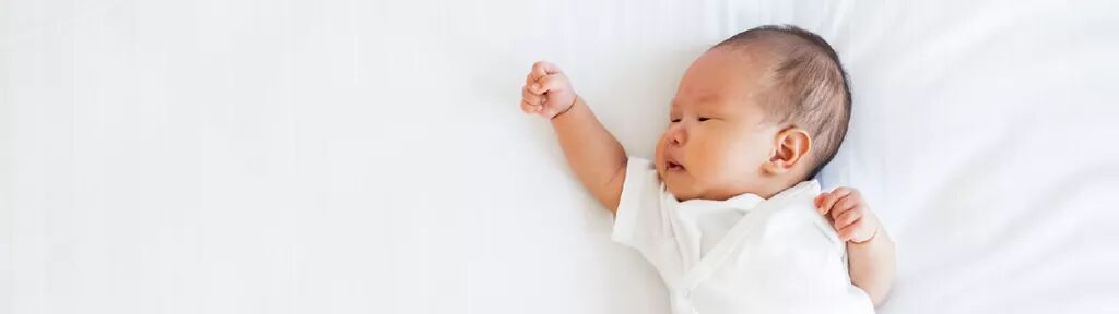 an image of a baby reaching out