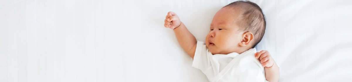 an image of a baby reaching out
