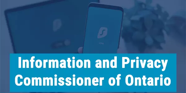 "Information and Privacy Commissioner of Ontario" on a photo of someone holding a phone in front of a laptop
