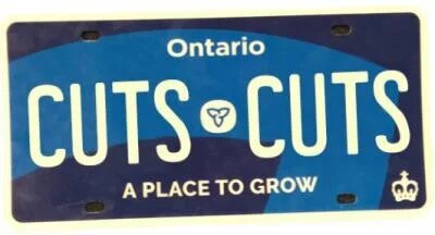A dark blue Ontario license plate with the words "CUTS CUTS" in lieu of a license plate number 