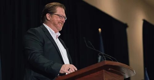 Dave Bulmer smiling at an AMAPCEO event