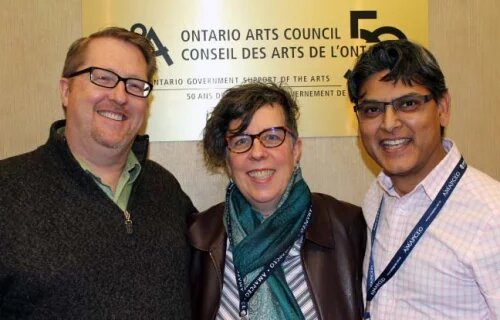 President Dave Bulmer stands with the Ontario Arts Council bargaining team in front of their offices/