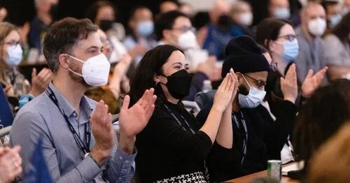 image of AMAPCEO members clapping at conference