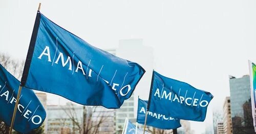 Several large AMAPCEO flags waving