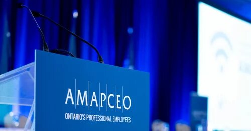 A mic on a podium with the AMAPCEO logo