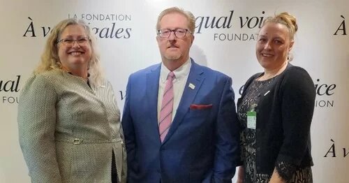 Cynthia Watt, Dave Bulmer, and Angela Stewart attending an International Women's Day event
