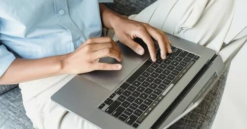 image of person working on a laptop