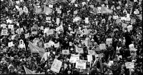 Historical photo of a crowd of protestors, taken from Mayworks' Days of Action: Then and Now exhibit