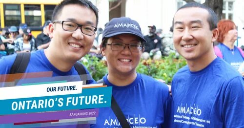 Photo of smiling AMAPCEO members wearing navy
