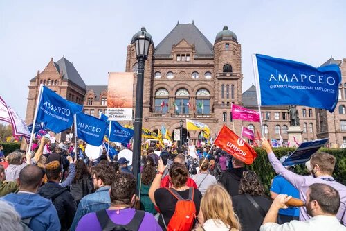 AMAPCEO members flying the flag in front of Queen's Park as part of the CUPE support rally