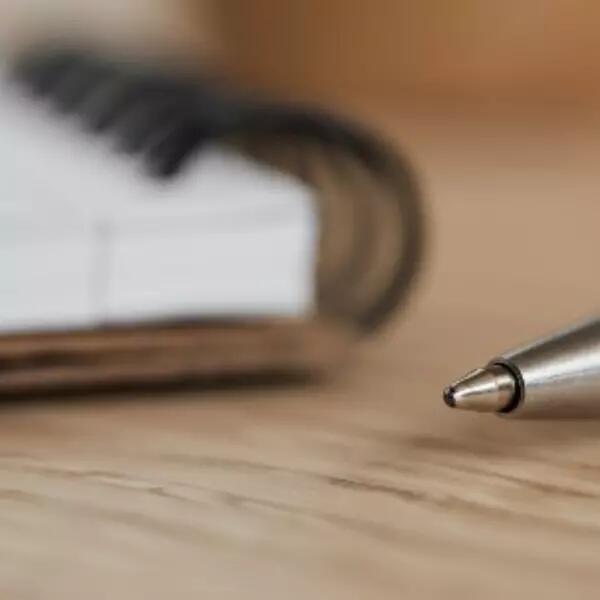 A notebook and a pen