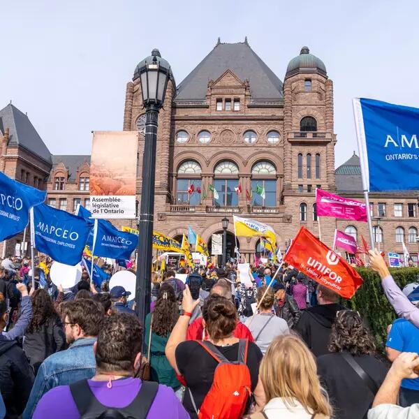 AMAPCEO members flying the flag in front of Queen's Park as part of the CUPE support rally